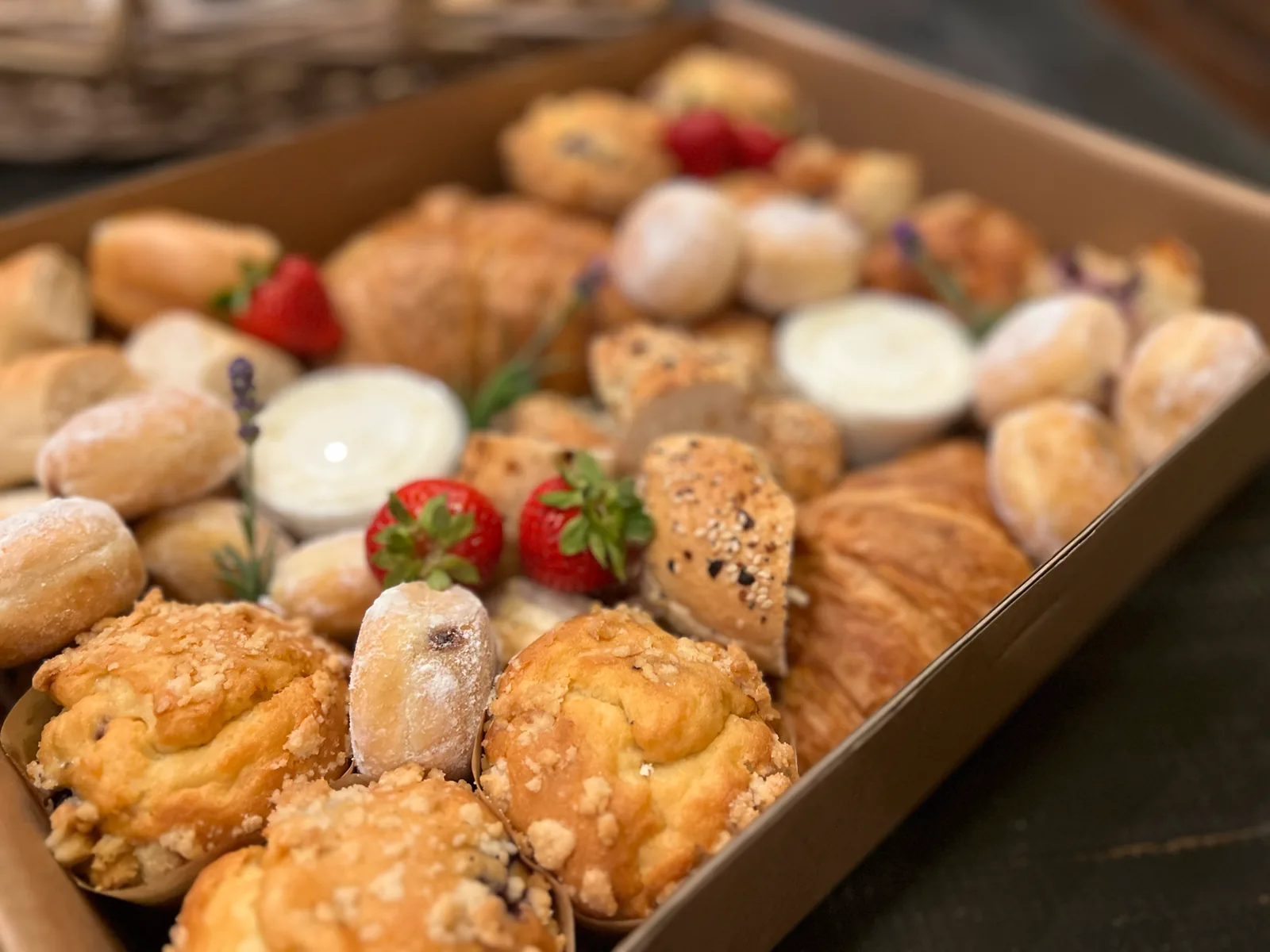 Custom brunch box with pastries and fruit prepared for a private flight