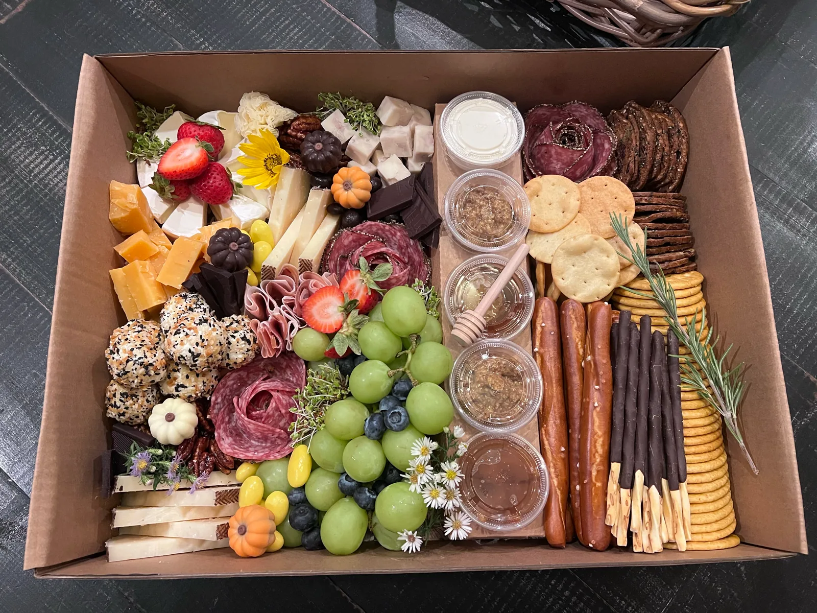 Custom charcuterie box prepared for a private flight, viewed from above
