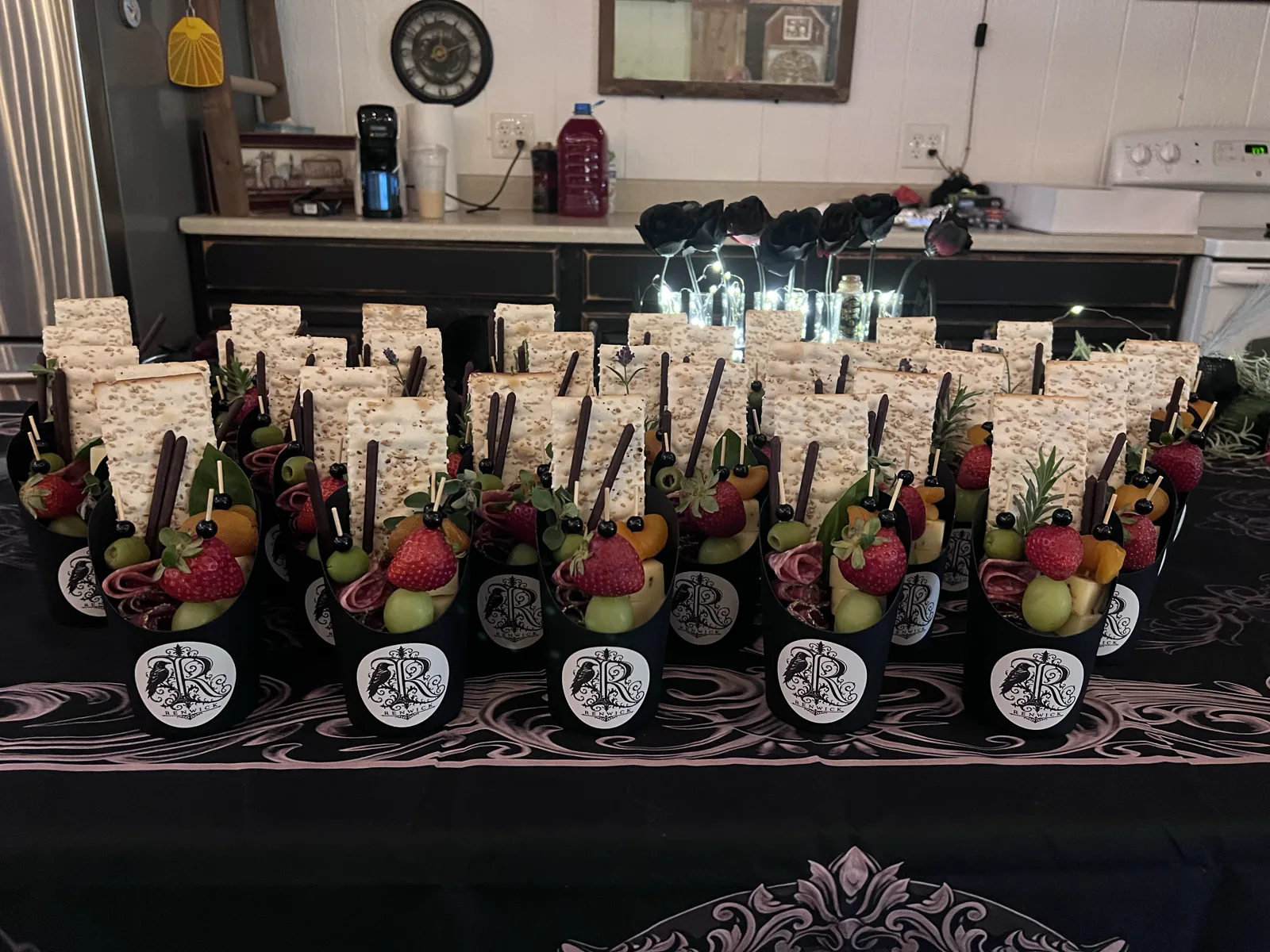 Bridal-shower charcuterie cups arranged with matching personalized stickers