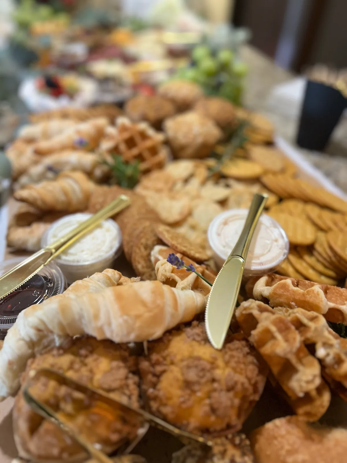 Custom wedding-morning brunch spread with pastries, waffles, and accompaniments